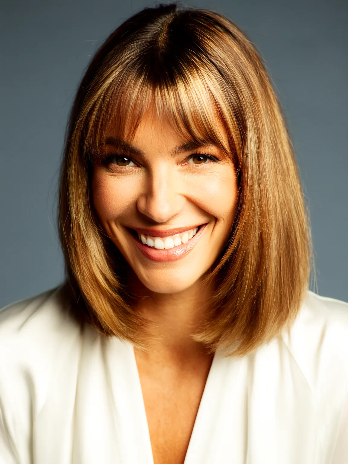 Blunt Bob with Curtain Bangs in Warm Caramel Brown
